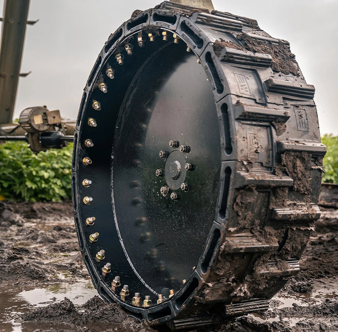 This image shows our pivot tires in the field being used on a muddy terrain.