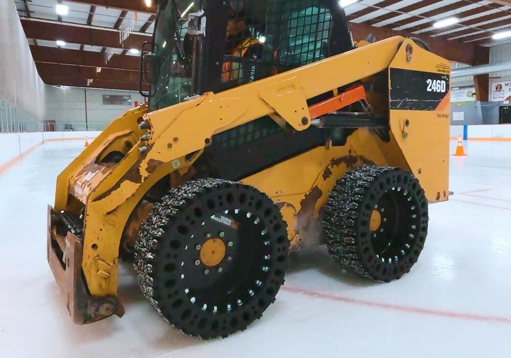 EWRS-SNOW skid steer tire on a machine